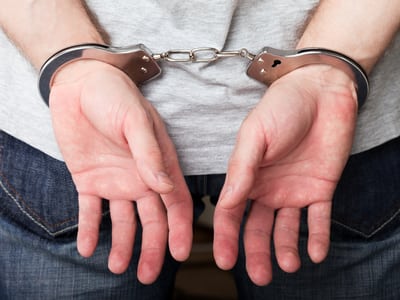 Young Man in Cuffs After Prescription Drug Arrest.
